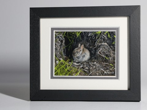 Miniature painting (front frame) of a rabbit in front of its burrow by the animal artist Laurence Saunois