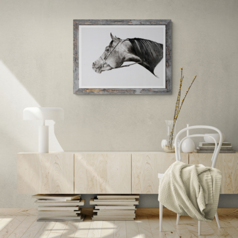 Portrait in China ink exhibited above a chest of drawers