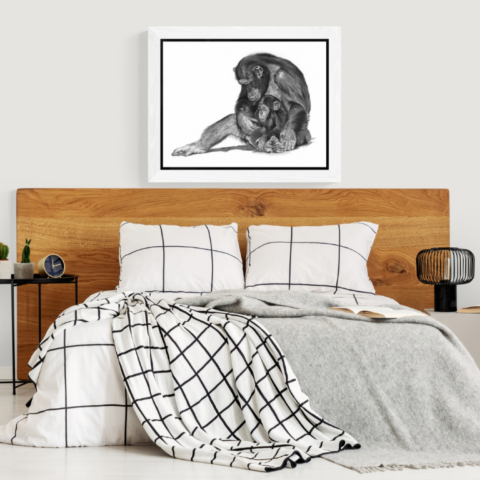  Charcoal artwork of a mother chimpanzee and her baby displayed above a bedroom bed – wildlife artist Laurence Saunois