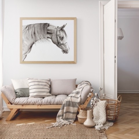 Horse painting in India ink above a sofa
