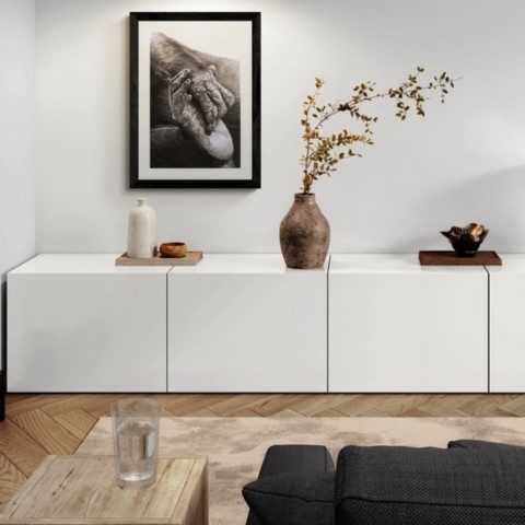  Charcoal artwork of a bonobo foot and hand displayed above a living room cabinet – wildlife artist Laurence Saunois