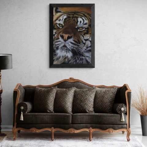 Tiger portrait painting wall art decor in a living room setting above an antique sofa by Laurence Saunois, wildlife Artist
