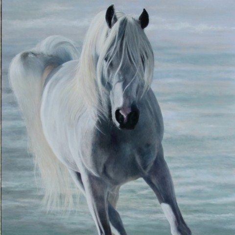 Oil painting of a horse galloping on the beach by wildlife artist Laurence Saunois
