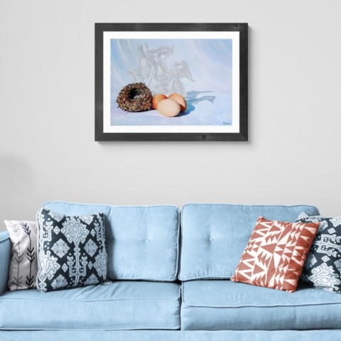 Eggs and nest painting wall art decor in a home setting above a sofa by wildlife artist Laurence Saunois