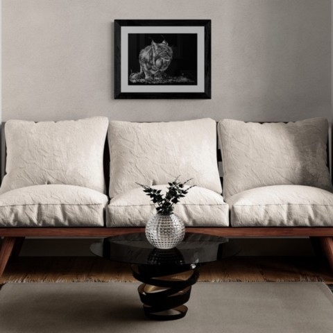 Scratchboard of a European lynx displayed above a sofa – wildlife artist Laurence Saunois